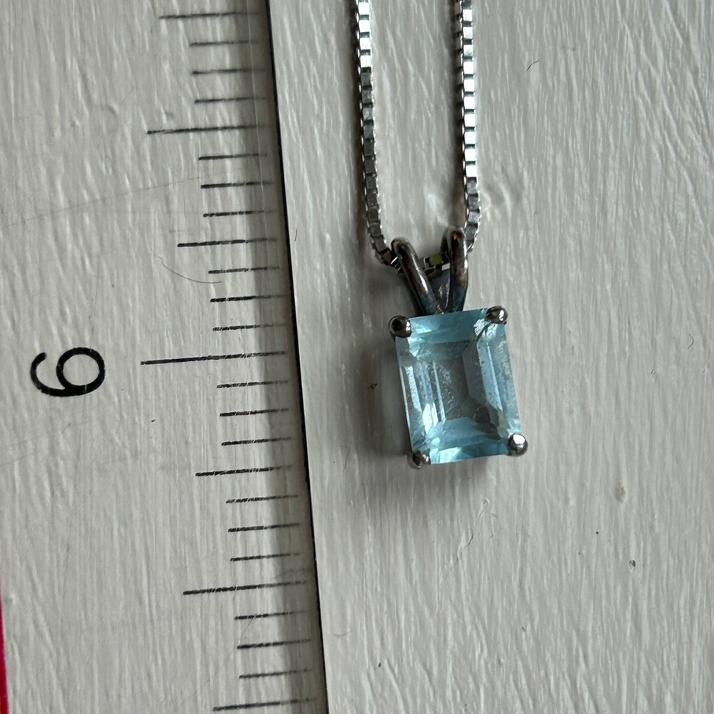 925 SS necklace with baby blue emerald cut stone